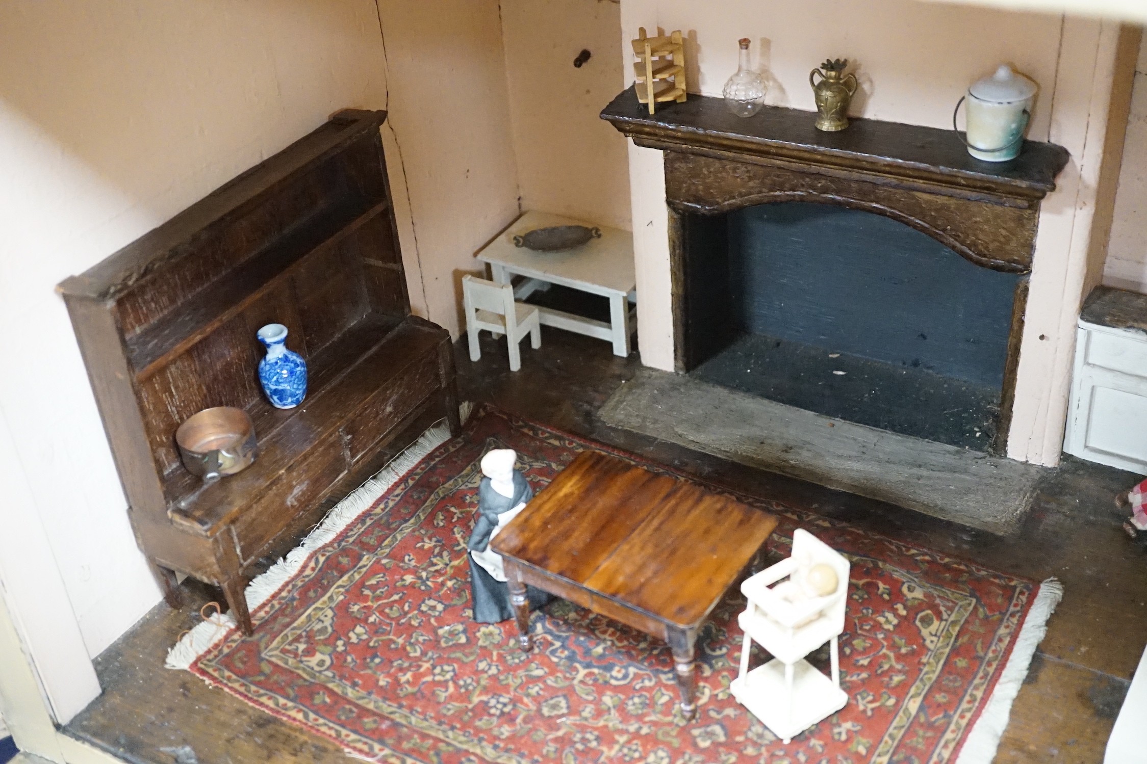 An early 19th century painted doll's house with block work facade enclosing a four room interior with central staircase, to be sold with assorted later furniture and accessories, width 117cm, depth 48cm, height with asso